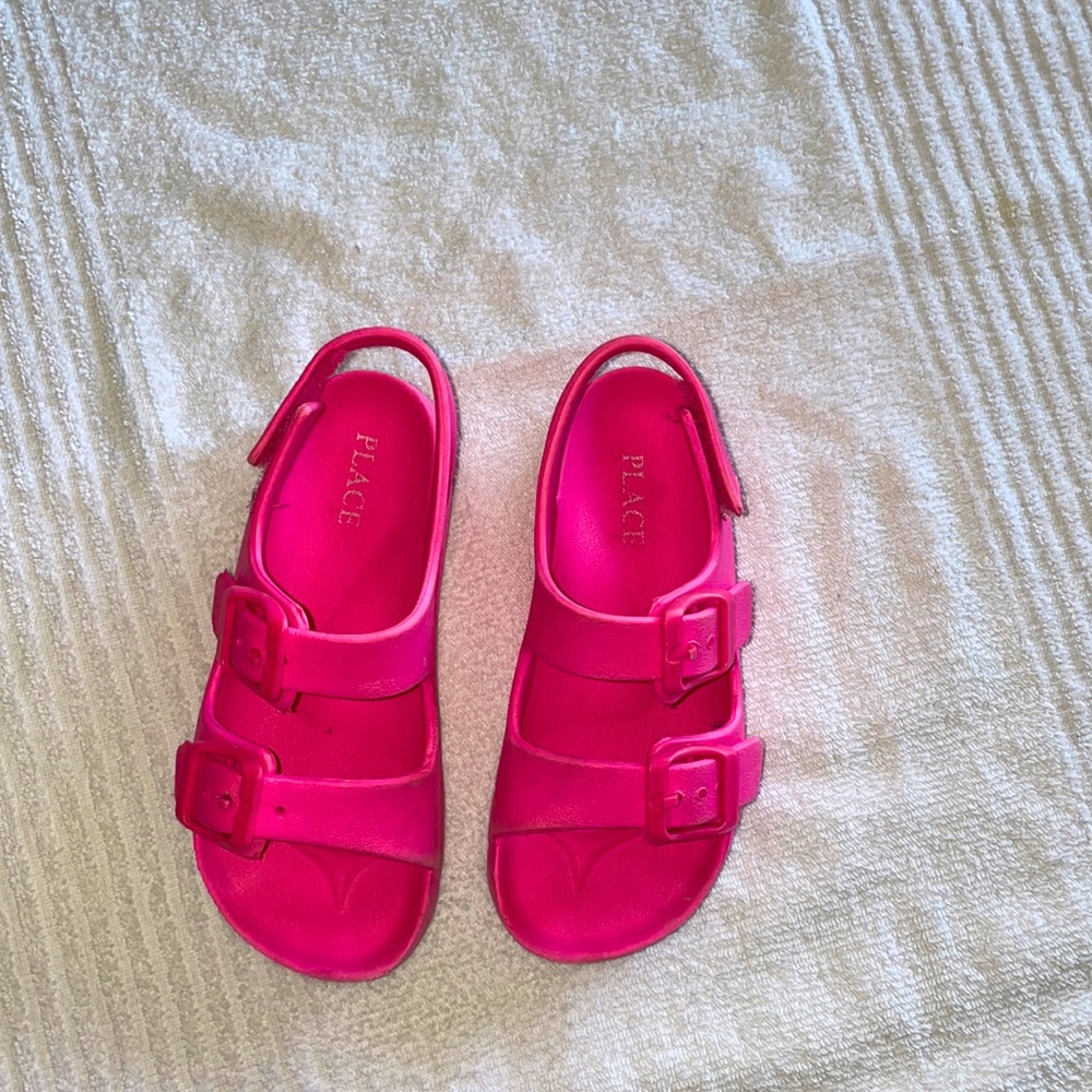 Children place buckle sandals